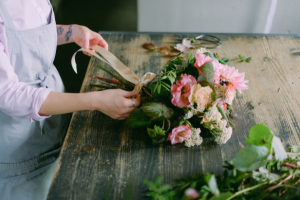 Woman arranging a bouquet of flowers